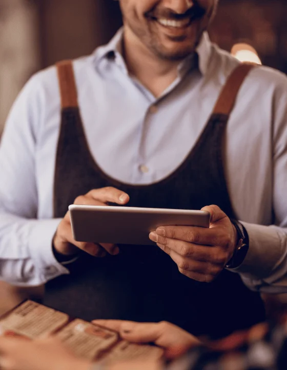 Staff referencing the app during service